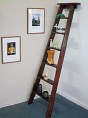 Turn an old ladder into a shelving unit.