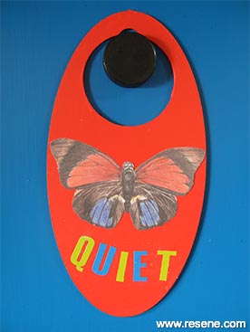 Door handle with a butterfly sticker