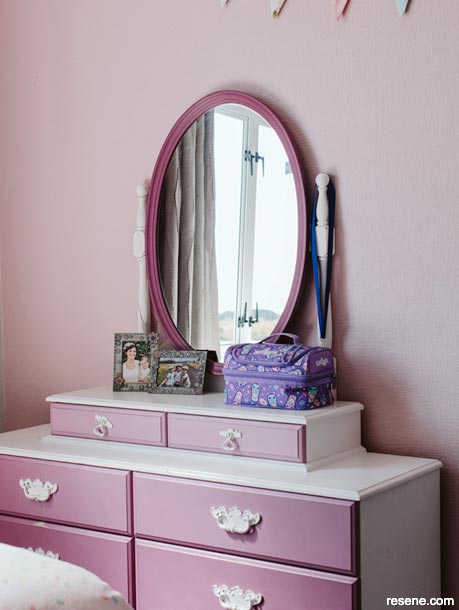 A pastel pink kids bedroom