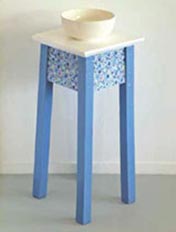 Paint an wooden stool to display your crafty artwork