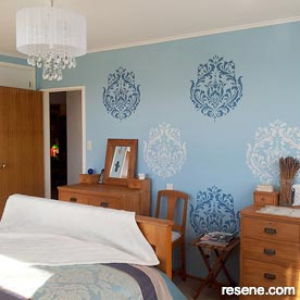 Painted blue wallpaper in bedroom