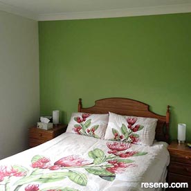 Green feature wall in bedroom
