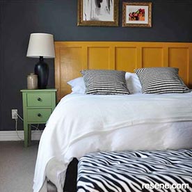 Deep blue feature wall in bedroom