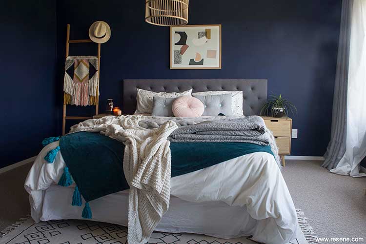 A rich dark blue bedroom