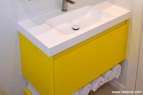 A yellow and white bathroom