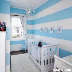 A softly striped baby's room