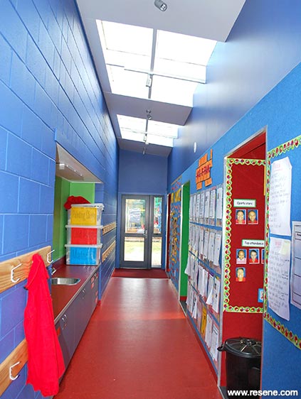 Blue and red school hallway