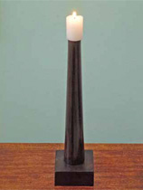 Make a candleholder from an old table leg and a block of timber 