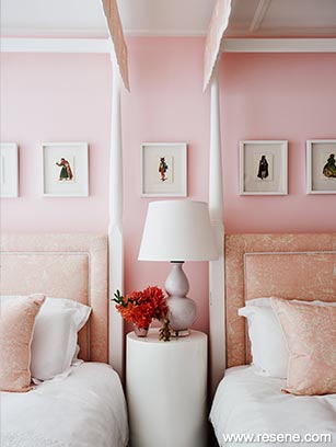 A closeup of the pink walls and headboards