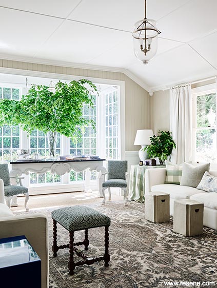 A sophisticated, calming sitting room in taupe and white