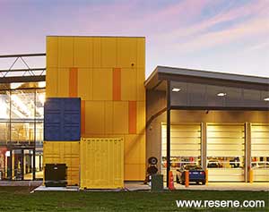 Custom created yellow and blue in Resene Summit Roof on exterior shipping containers