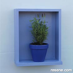 Make garden art with a framed lavender plant