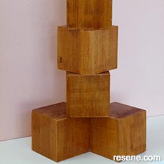 Create a cubist wooden sculpture