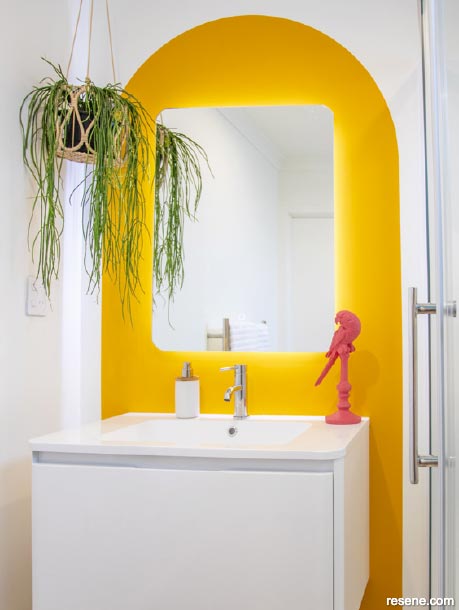 A bathroom with a bright pop of colour