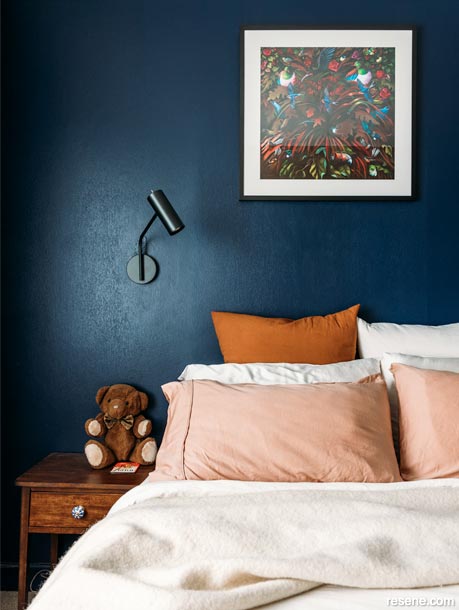A dark blue bedroom