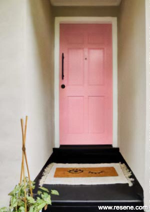 A pink entryway door in Resene Glamour Puss