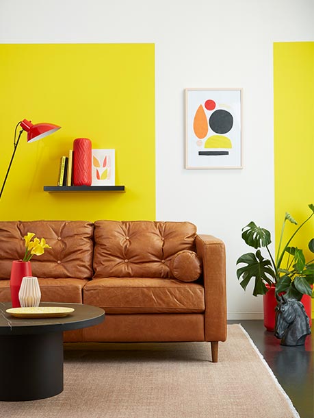 A yellow and white lounge in a mid-mod design