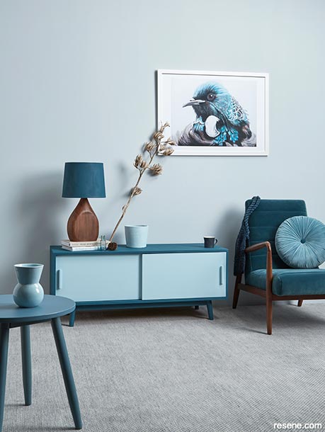 A light blue lounge with tui artwork