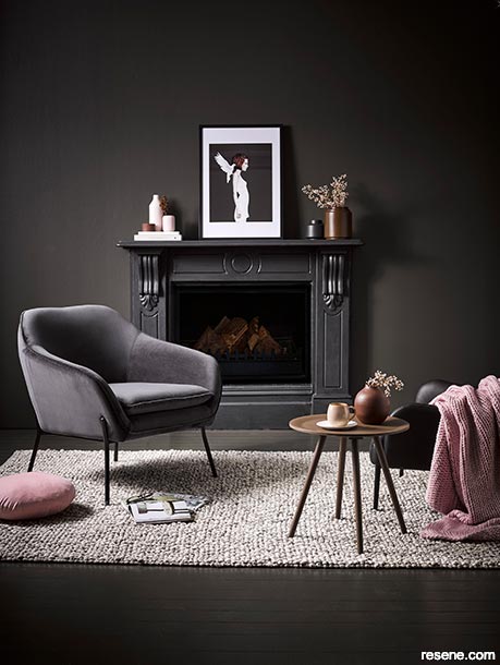 A lounge painted in cocooning deep dark colours