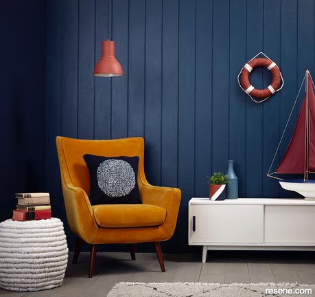 A dark blue nautical themed lounge