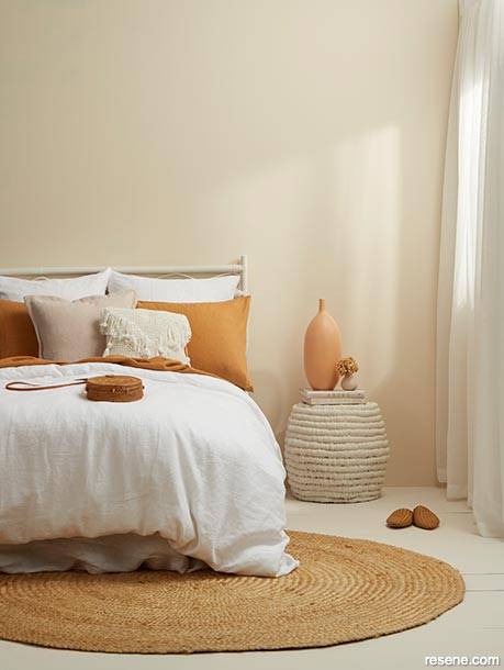A bedroom painted in soulful neutrals and warming apricots