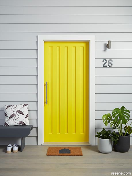 Paint your front door bright yellow to freshen up your home