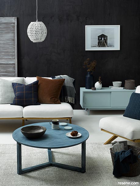 A lounge with stained deep dark blue walls