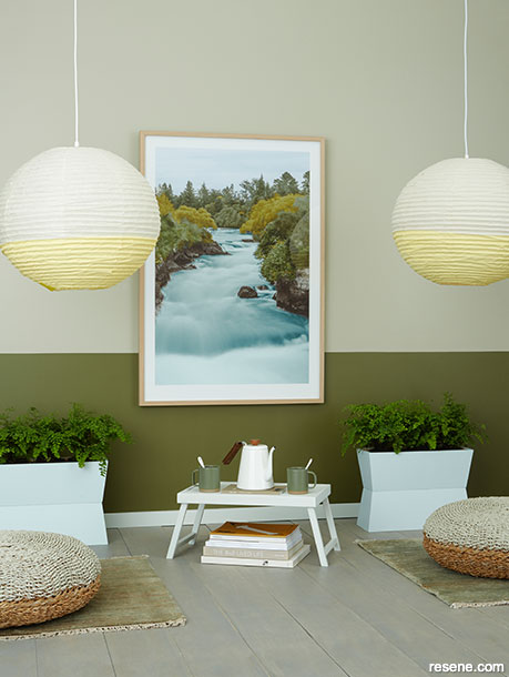 A serene sitting area painted in botanical green