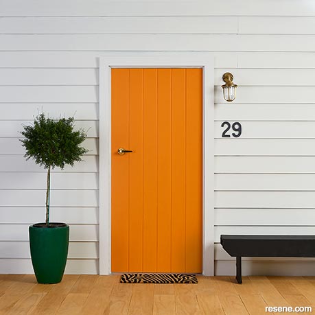 A bold orange front door