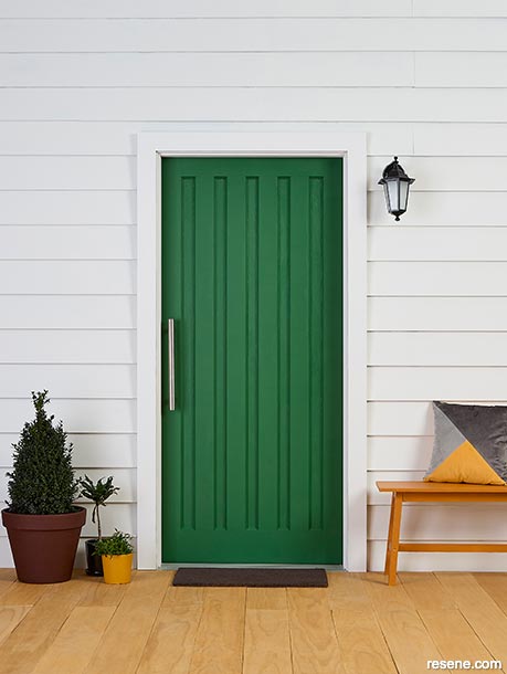 A sophisticated green front door