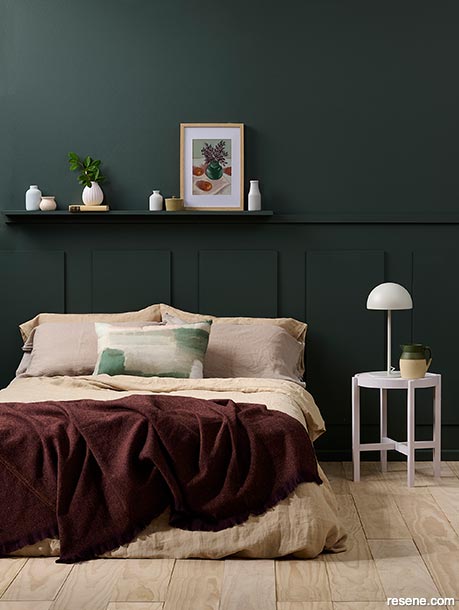 A sophisticated deep green bedroom