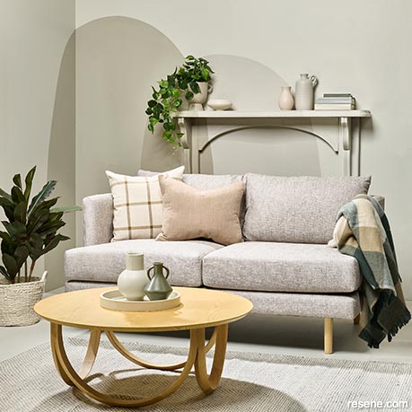 A neutral lounge with painted arch shapes