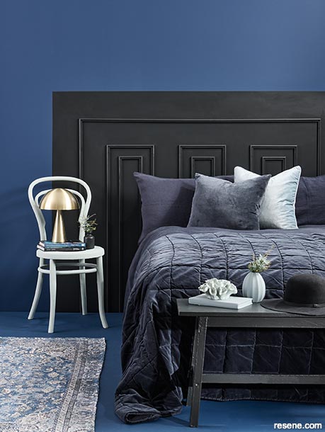 A dark black and blue bedroom