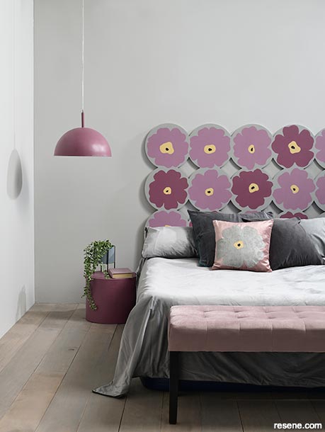 Muted mauve and violet flowers feature in this bedroom