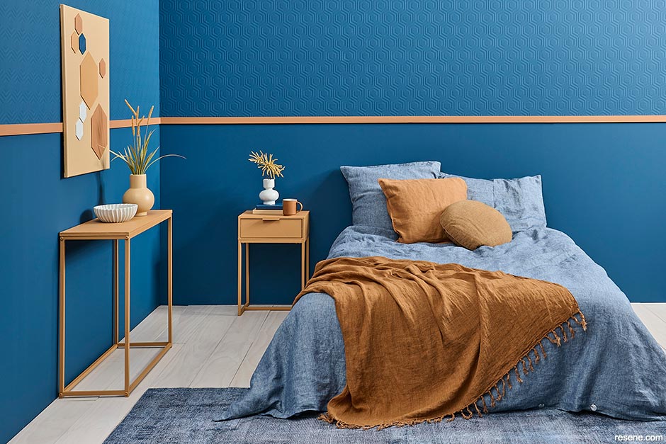 A blue bedroom with caramel accents
