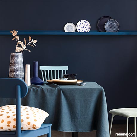 A dark blue dining room