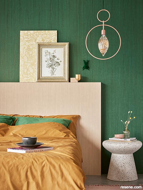 A green wallpapered bedroom