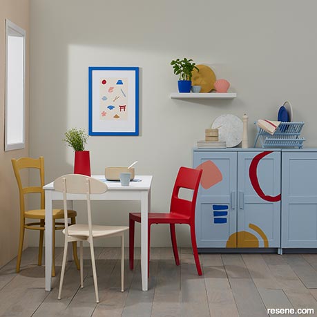 A vibrant dining room with pops of primary colour