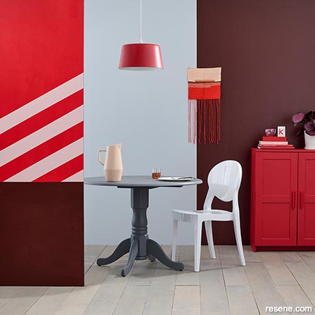A statement dining area using raspberry shades