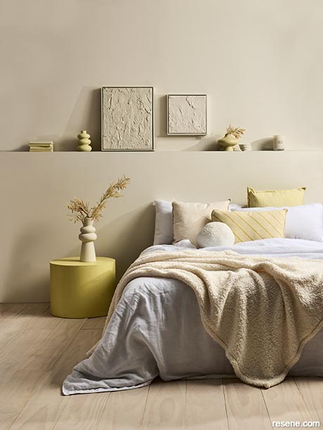 Honeyed yellows have a powerful impact in this bedroom