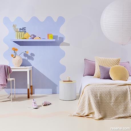 A lavender bedroom with playful painted shapes