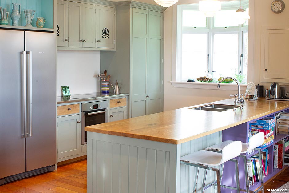 A light green and purple kitchen