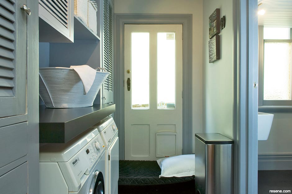 A blue-grey toned laundry room