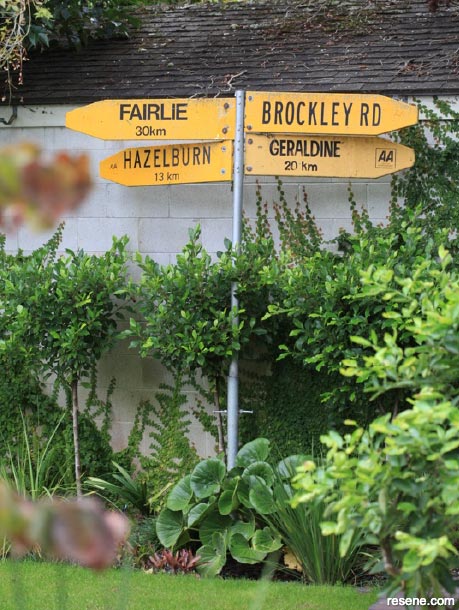 Paint a fun signpost in your garden
