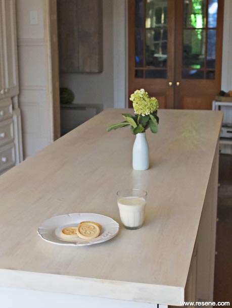 A whitewashed kitchen table