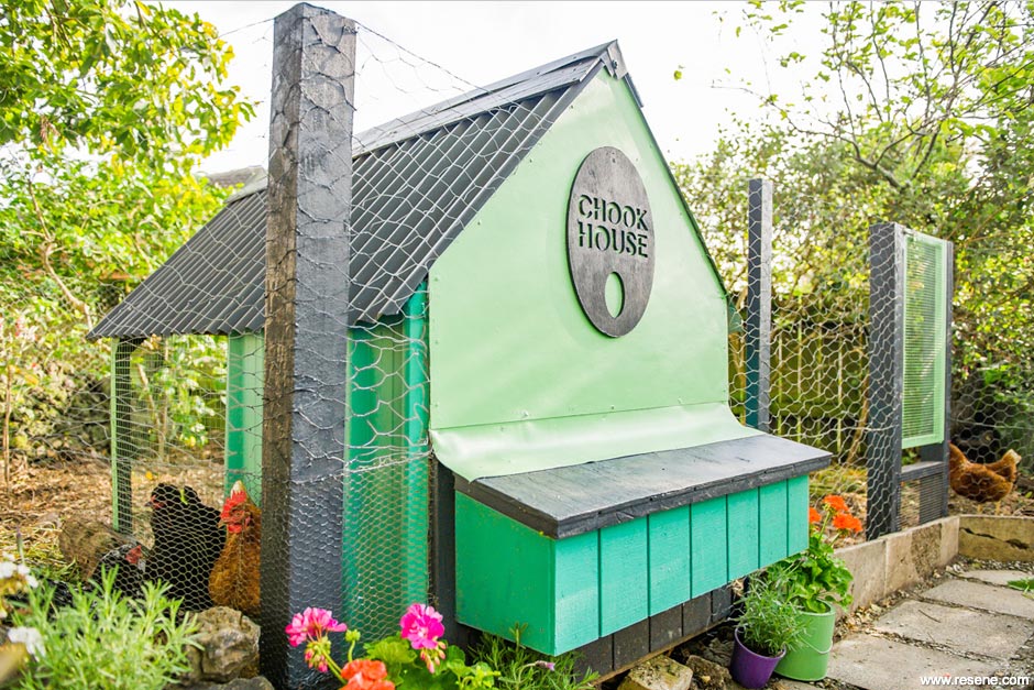 A painted hen house garden feature