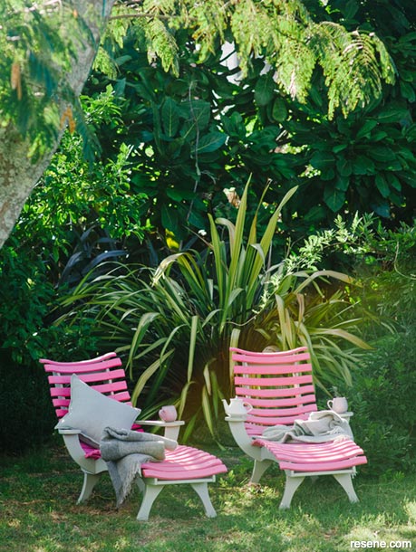Repaint an outdoor wooden recliner in pink and lemongrass