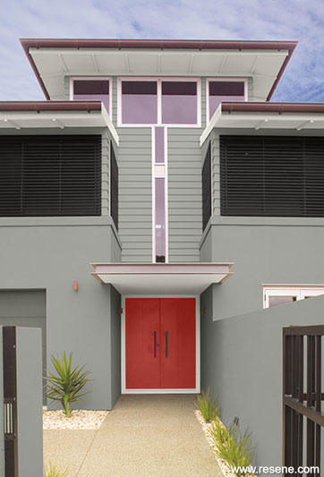 A bold red front door entranceway.