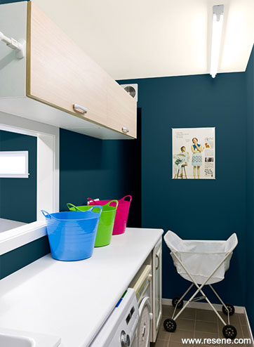 Dark colours can make the laundry look larger