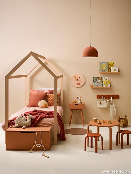 An orangey pink kid's bedroom